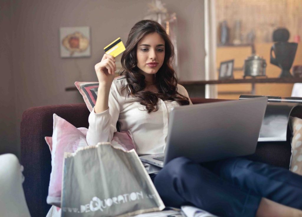 A woman shops online from home.
