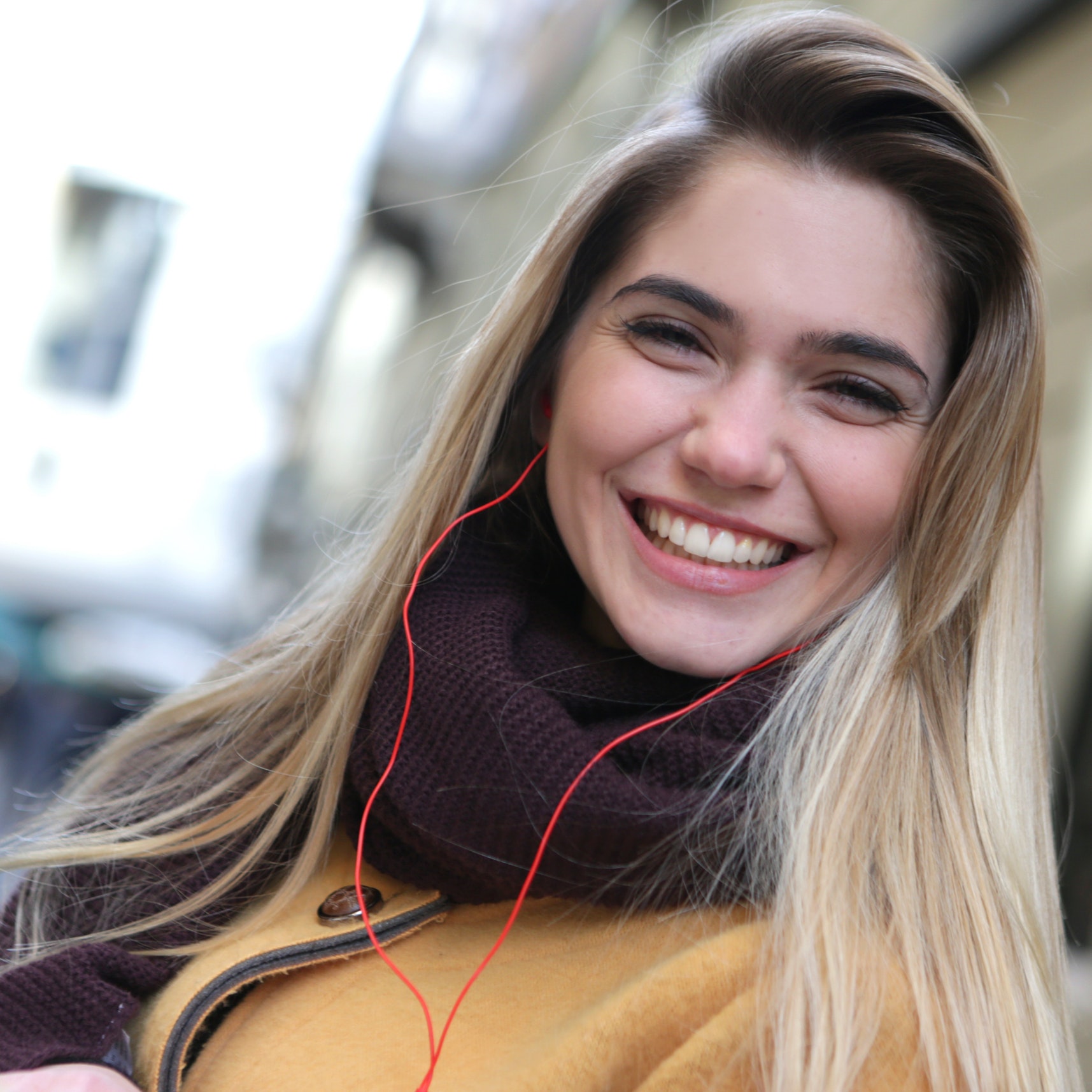 Smiling woman outside of hair salon