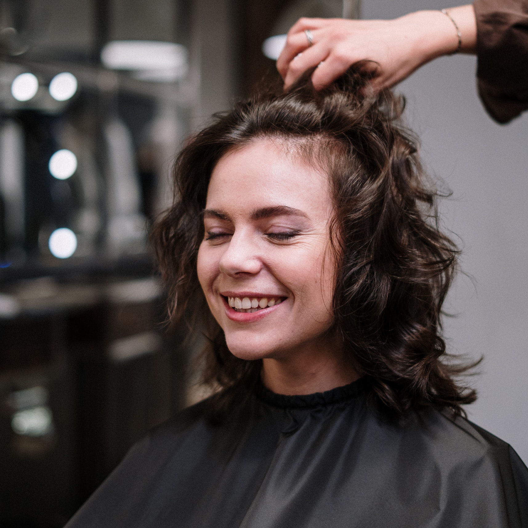 Smiling woman at hair salon