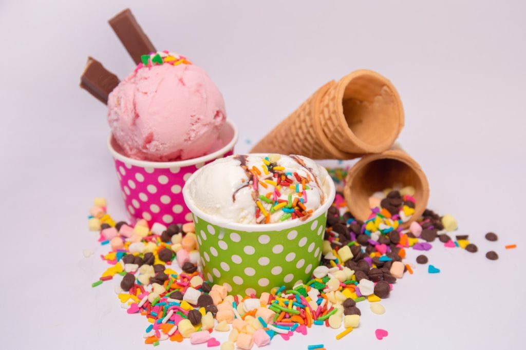 Ice cream and sprinkles in cups.