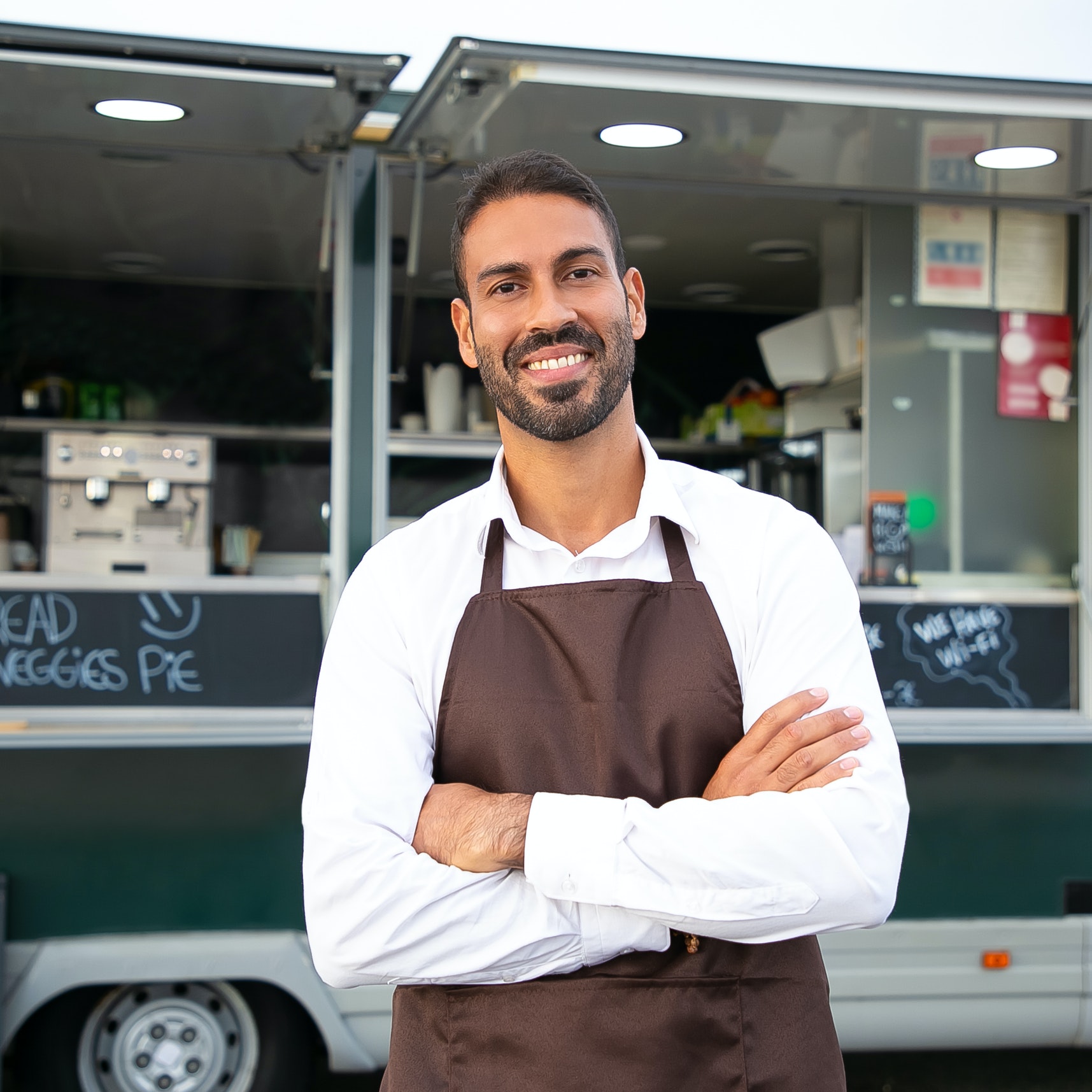 Smiling man outside food truck