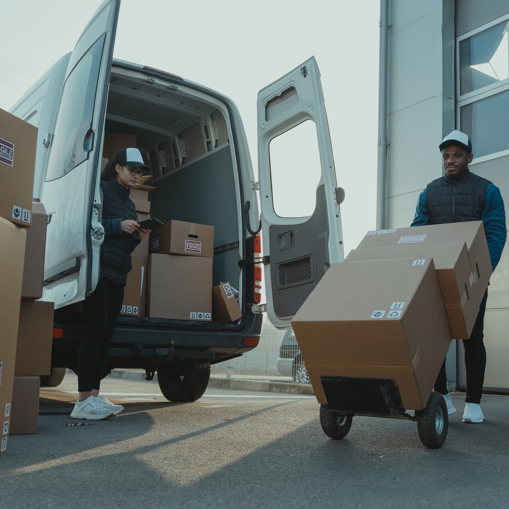 A delivery truck brings new inventory to a store