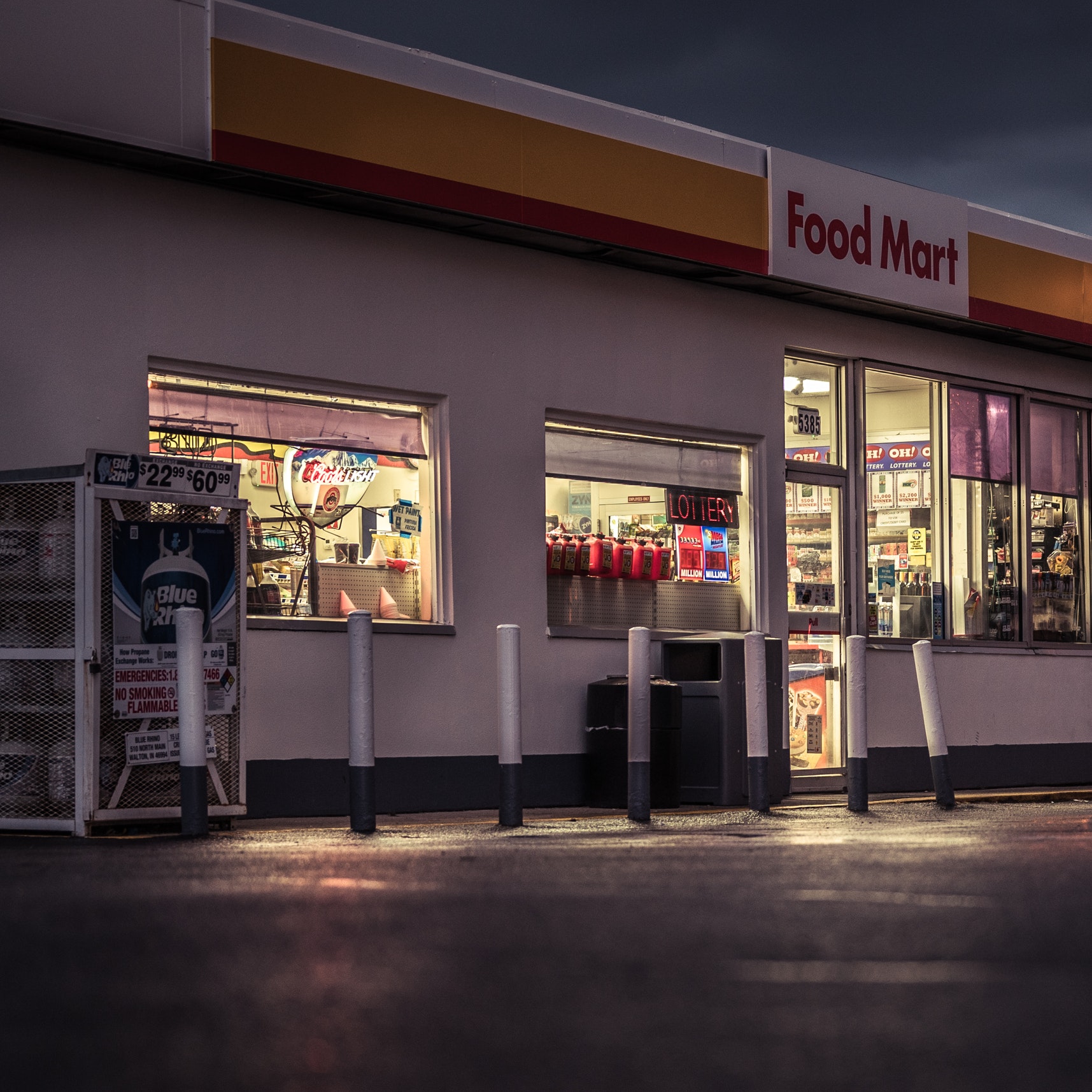 A gas station store front at night