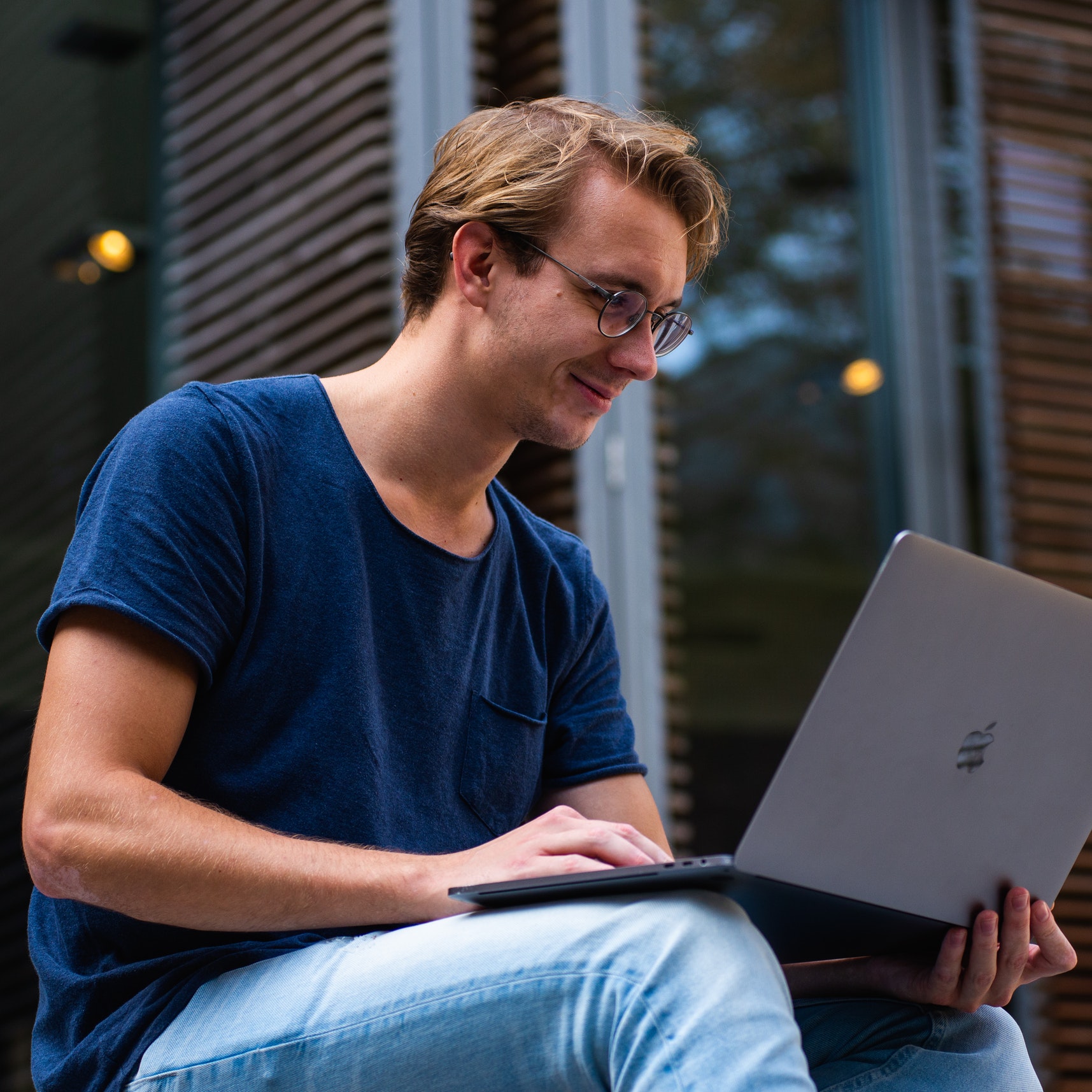 A man views sales data on his laptop