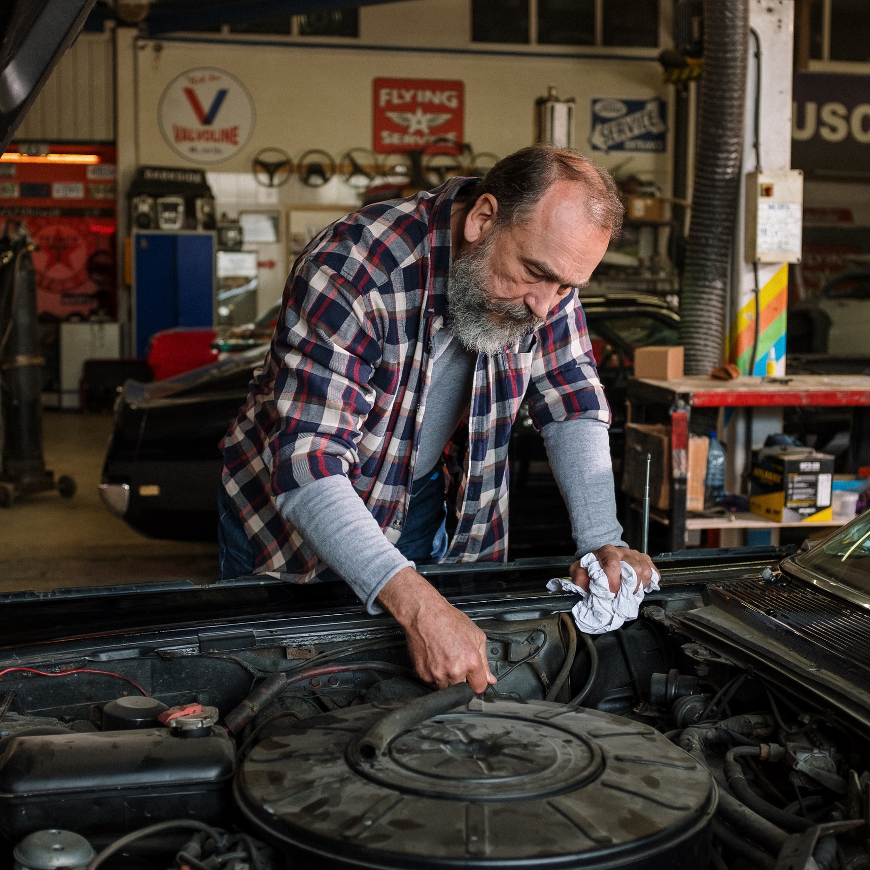 A mechanic working on a car