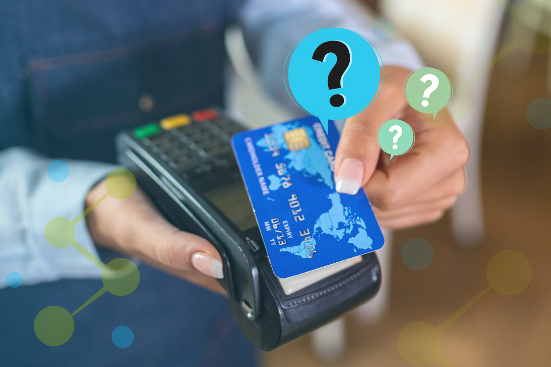 A person holding a debit card