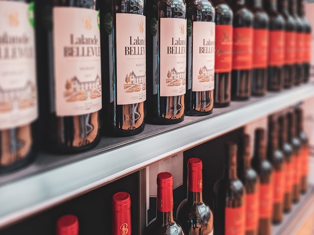 Wine inventory organized on a liquor store shelf